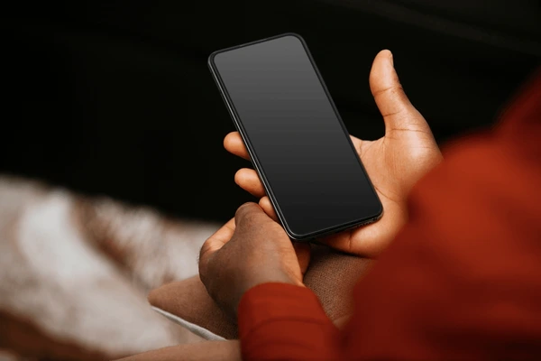 A landlord checking rent on a phone